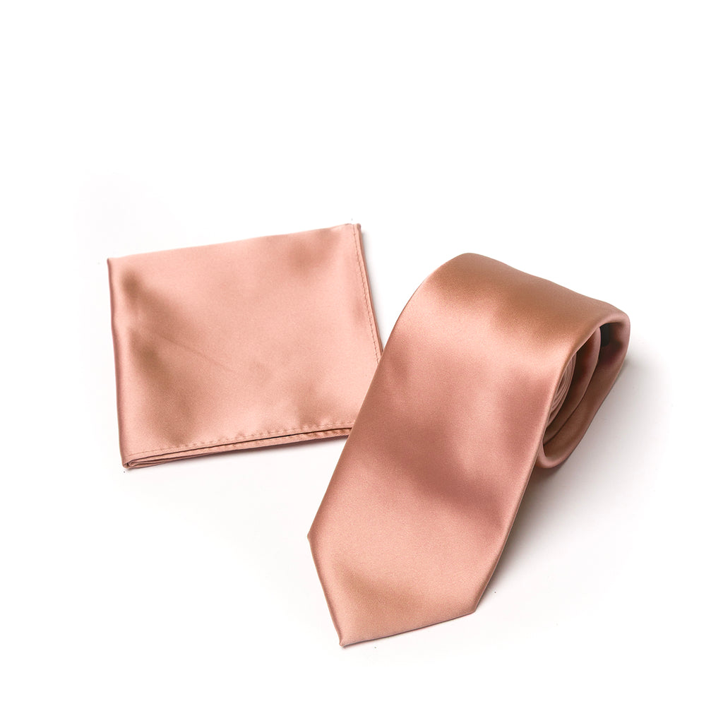 Copper pink tie and pocket square set on a white background